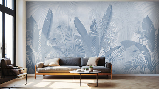 An architectural perspective of a contemporary living room featuring the Banana Grove Mural in Pacific Blue as a full-scale feature wall behind a low-profile cream sofa. The mural’s cooling botanical composition pairs elegantly with light oak flooring and neutral textiles, creating a peaceful and immersive coastal-inspired retreat.