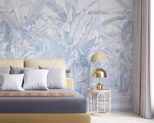 A high-resolution detail of the Banana Grove Dreams Blue Wallpaper, highlighting the delicate painterly textures and hand-painted veining of the tropical leaves. The image showcases the refined tonal transitions between deep teal, dusty blue, and soft ivory that define this nature-inspired mural.