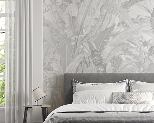 A high-resolution detail of the Banana Grove Dreams Grey Wallpaper, highlighting the delicate painterly textures and hand-painted veining of the tropical leaves. The image showcases the refined tonal transitions between smoky charcoal, misty grey, and soft ivory that define this nature-inspired mural.