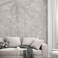 A high-resolution detail of the Banana Grove Dreams Soft Ash Tropical Wallpaper, highlighting the delicate painterly textures and hand-painted veining of the large tropical leaves. The image showcases the refined tonal transitions between smoky ash, charcoal, and soft ivory that define this nature-inspired mural.