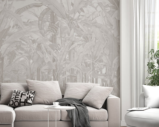 A high-resolution detail of the Banana Grove Dreams Soft Ash Tropical Wallpaper, highlighting the delicate painterly textures and hand-painted veining of the large tropical leaves. The image showcases the refined tonal transitions between smoky ash, charcoal, and soft ivory that define this nature-inspired mural.