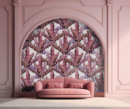 An architectural perspective of a contemporary living room featuring the Banana Leaves Pattern as a full-scale accent wall. The wallpaper’s soft green and cream tones pair elegantly with neutral upholstery, light oak furniture, and minimalist decor, creating a high-energy yet serene tropical atmosphere.