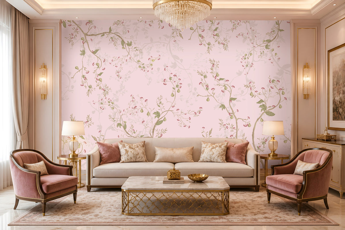 Blush Pink floral wallpaper featuring an elegant botanical design with delicate soft pink blossoms, muted green leaves, graceful winding branches, and subtle ivory floral detailing, creating a sophisticated and seamless visual flow across the feature wall. The wallpaper is showcased in a luxurious contemporary living room with a soft neutral sofa, blush pink velvet accent chairs, decorative cushions, gold-finished side tables, elegant table lamps, a statement crystal chandelier.
