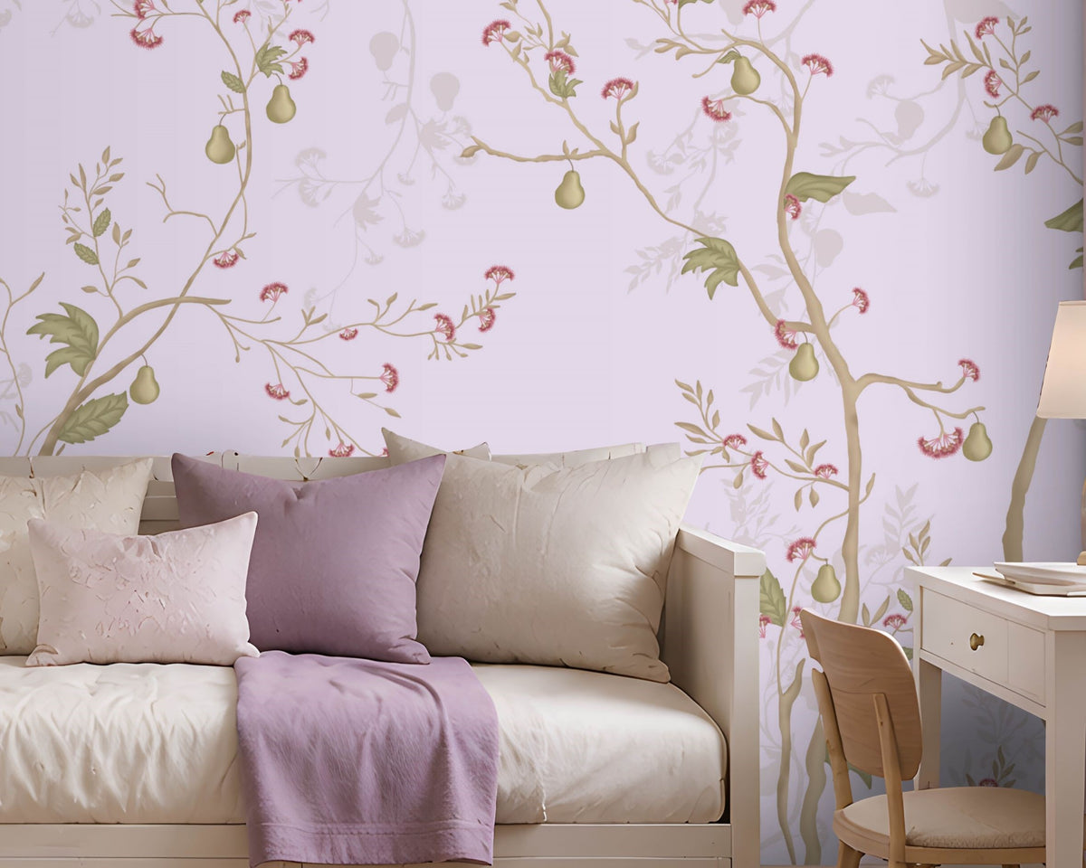 "A serene bedroom with a white daybed topped with purple and cream pillows and a lavender throw blanket. A floral pastel wallpaper covers the wall behind, featuring delicate vines in lavender, green, and pink. To the right, a white desk with a wooden chair, lamp, and vase of flowers sits near a window with Roman shades. Built-in shelves on the left display books and decorative items. Soft natural light and a ceiling lamp create a calm, elegant atmosphere."