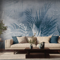 An architectural perspective of a refined contemporary lounge featuring the Breeze Mural in Periwinkle Blue as a full-scale feature wall. The mural’s cool, soothing tones pair strikingly with minimalist furniture, a light-colored rug, and natural greenery, creating a peaceful and cultured interior sanctuary.