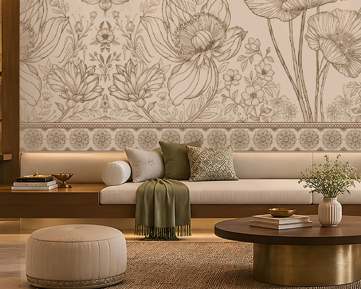 A large-scale floral wall mural with detailed poppy and wildflower line art in beige and brown tones, displayed in a modern living room setting above a long white sofa with green cushions.
