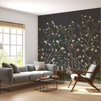 Charcoal grey peony floral mural wallpaper with artistic botanical pattern in contemporary bedroom.