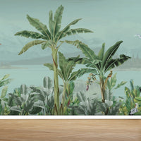 An architectural perspective of a modern living space featuring the Coastal Canopy Mural as a full-width panoramic feature wall. The mural’s expansive landscape pairs elegantly with light-toned chevron wood flooring and minimalist furniture, creating a peaceful, immersive retreat.