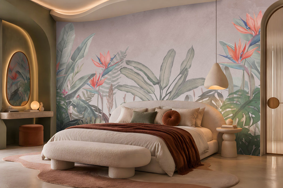 Earthy Tropical Oasis - Dusty Mauve Pink botanical wallpaper featuring oversized tropical foliage, elegant bird-of-paradise flowers in coral pink and muted blue, and layered olive green leaves against a soft dusty mauve pink background. Showcased in a luxurious bedroom with a curved cream upholstered bed, earthy terracotta accents, plush neutral bedding, and warm ambient lighting, this elegant tropical wallpaper combines delicate pink undertones with natural botanical elements to create a serene