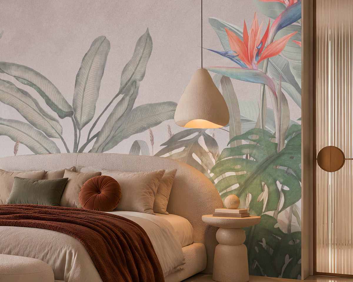 Earthy Tropical Oasis - Dusty Mauve Pink botanical wallpaper featuring oversized tropical foliage, elegant bird-of-paradise flowers in coral pink and muted blue, and layered olive green leaves against a soft dusty mauve pink background. Showcased in a luxurious bedroom with a curved cream upholstered bed, earthy terracotta accents, plush neutral bedding, and warm ambient lighting, this elegant tropical wallpaper combines delicate pink undertones with natural botanical elements to create a serene