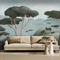 An architectural perspective of a contemporary living area featuring the Ethereal Landscapes Mural in Charcoal Green as a full-scale feature wall behind a minimalist beige sofa. The mural’s wide-angle scenic view pairs elegantly with light wood flooring and organic decor, creating a peaceful and cultured interior sanctuary.