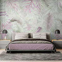 Silver pink colour Exotica Blend tropical leaf mural wallpaper installed as a feature wall in a living room, dining room, and bedroom, showcasing soft pink tones and modern tropical mural wallpaper design.