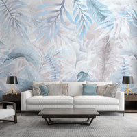 Summer blue colour Exotica Blend tropical leaf mural wallpaper installed as a feature wall in a living room, dining room, and bedroom, showcasing vibrant blue tones and modern tropical mural wallpaper design.