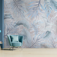 Summer blue colour Exotica Blend tropical leaf mural wallpaper installed as a feature wall in a living room, dining room, and bedroom, showcasing vibrant blue tones and modern tropical mural wallpaper design.