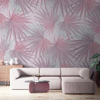 An architectural perspective of a contemporary minimalist lounge featuring the Fan Palm Leaves Mural in Chalky Pink as a full-scale feature wall. The mural’s warm, oversized botanical patterns pair elegantly with natural oak furniture, cream textiles, and clay pottery, creating a serene and cultured interior sanctuary.