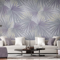 An architectural perspective of a contemporary minimalist lounge featuring the Fan Palm Leaves Mural in Muted Gray as a full-scale feature wall. The mural’s neutral, oversized botanical patterns pair elegantly with black metal accents, sleek furniture, and polished concrete flooring, creating a serene and cultured interior sanctuary.
