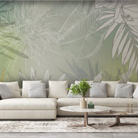 An architectural perspective of a contemporary living space featuring the Floral Fusion Mural in Pale Green as a full-scale feature wall. The mural’s soft, verdant tones pair elegantly with light birch furniture, white linen upholstery, and matte black hardware, creating a serene and cultured interior sanctuary.