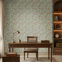Sage green seamless floral wallpaper featuring an intricate repeating pattern of delicate pink, blush, and peach flowers intertwined with slender green botanical vines and leaves. The elegant floral motifs are arranged in a balanced continuous pattern, creating a soft, graceful, and sophisticated look. The muted pastel palette complements traditional Indian-inspired interiors while adding a fresh, serene, and luxurious character to the wall.
