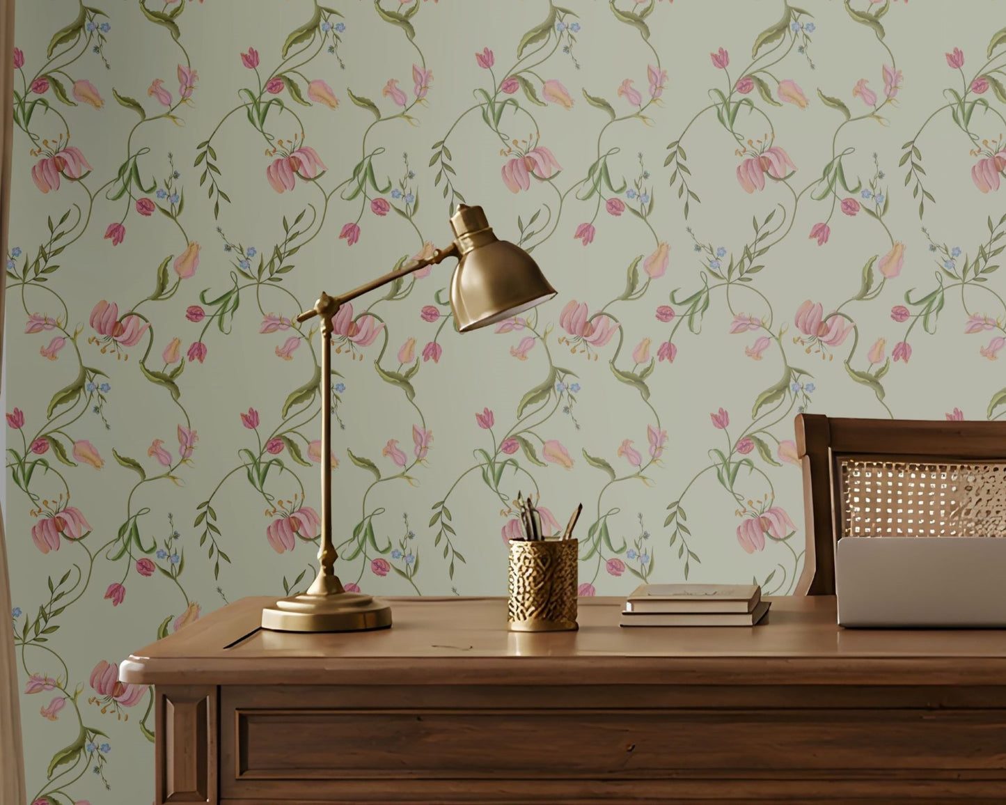 Sage green seamless floral wallpaper featuring an intricate repeating pattern of delicate pink, blush, and peach flowers intertwined with slender green botanical vines and leaves. The elegant floral motifs are arranged in a balanced continuous pattern, creating a soft, graceful, and sophisticated look. The muted pastel palette complements traditional Indian-inspired interiors while adding a fresh, serene, and luxurious character to the wall.
