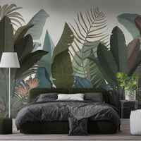 Ebony botanical leaf mural wallpaper installed as a feature wall in living room, dining room, and bedroom interiors with bold tropical design.
