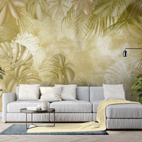 An architectural perspective of a high-end sunroom featuring the Foliage Fresco Mural in Old Gold as a full-scale feature wall. The mural’s warm, monochromatic gold tones pair strikingly with dark wood furniture and brass accents, creating a peaceful and cultured interior sanctuary bathed in natural light.