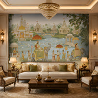 A large wall mural depicting a traditional Indian palace scene with elephants, figures, and water, installed behind a cream sofa in a styled living room with lamps, chairs, and a coffee table.