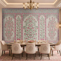 Gulmohar – Blush Blossom floral wallpaper featuring blush pink botanical motifs, birds, and Mughal-inspired panel design installed as a statement wall in an elegant dining room.