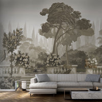 An architectural perspective of a sophisticated study or formal dining room featuring the Harmony Mural in Sepia Mirage as a full-scale feature wall. The mural’s expansive garden vista pairs elegantly with dark wood antiques and warm ambient lighting, creating a peaceful and cultured interior sanctuary.