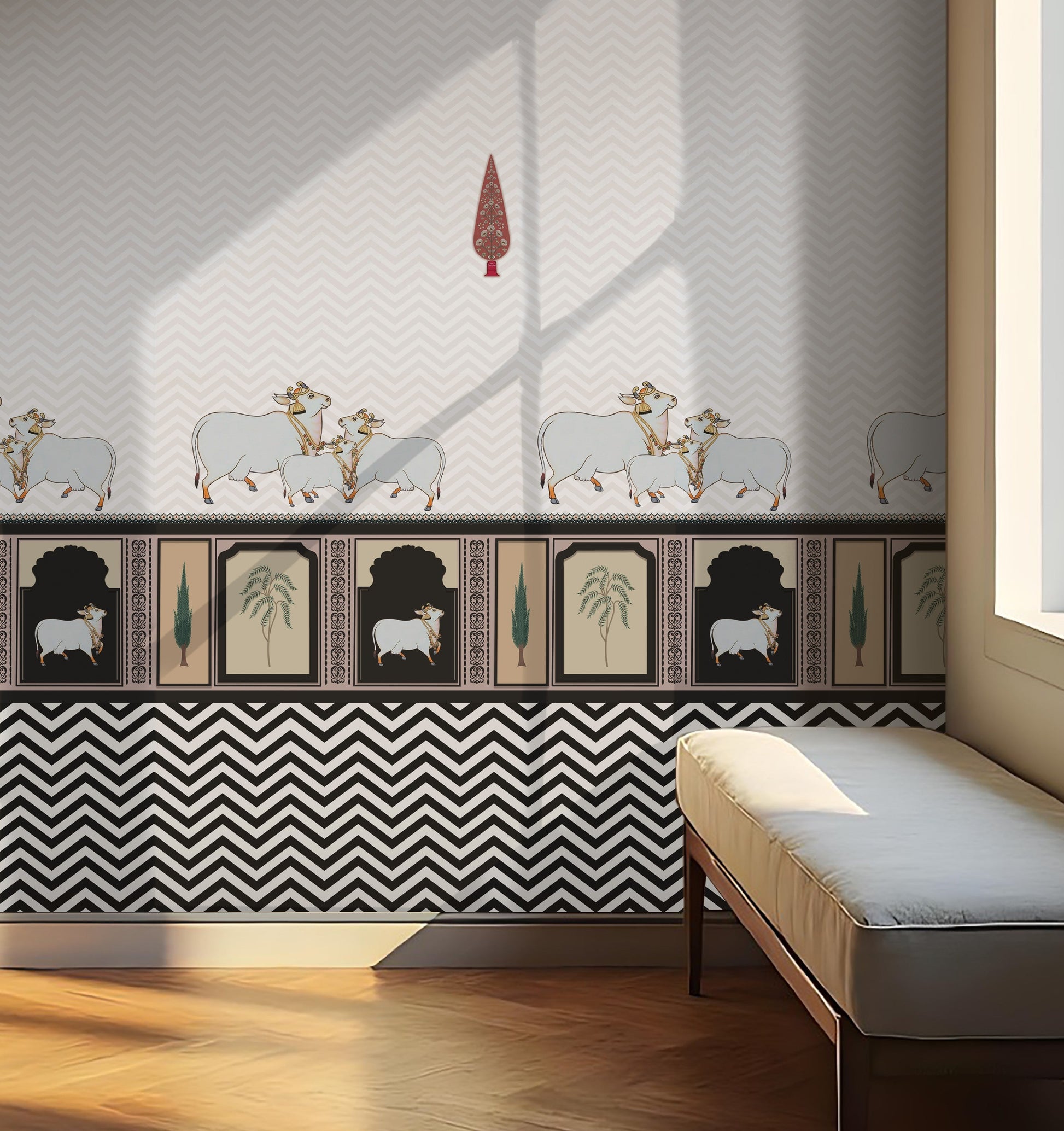 Black-and-white interior scene with a patterned wall featuring small animal motifs and geometric designs. A cushioned bench sits along the wall beside a large window letting in soft light. A hanging ceiling lamp is visible above, and sunlight casts angular shadows across the wall and wooden floor.