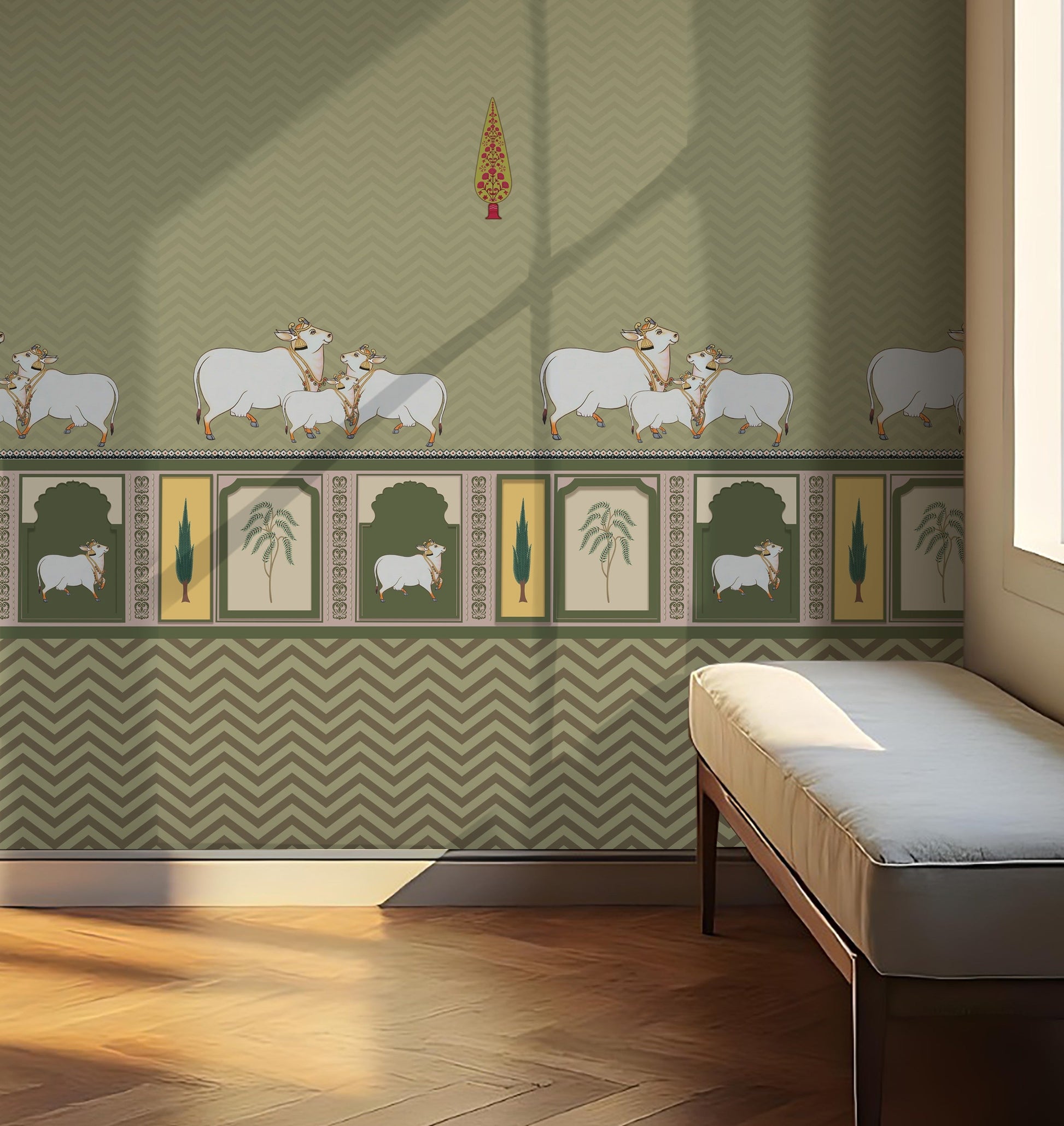Green-toned interior wall with a repeating chevron pattern and decorative border featuring illustrated cows and plant motifs. A cushioned bench sits to the right near a window, where sunlight casts soft shadows across the wall and wooden floor.