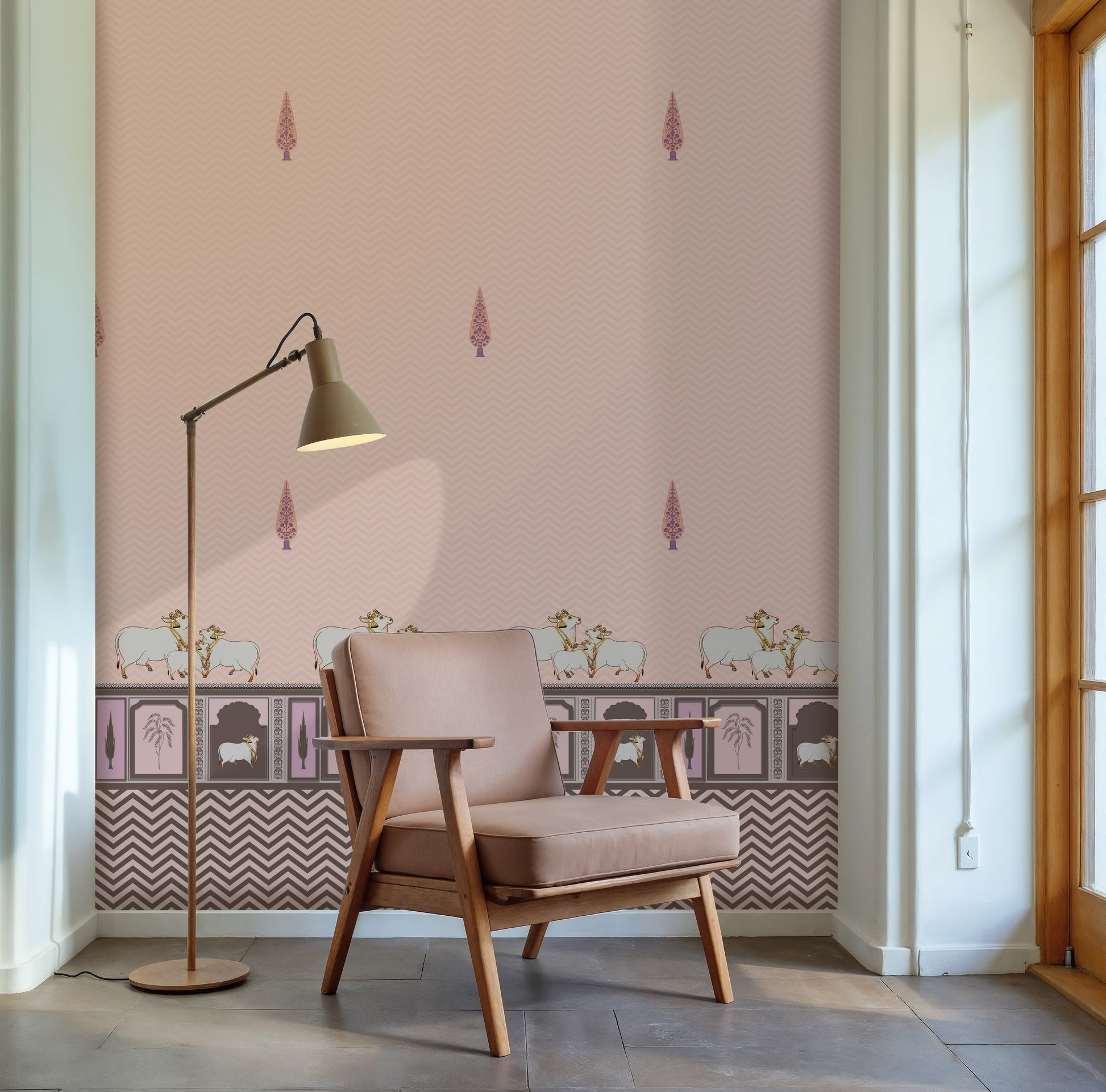Light pink Pichwai wallpaper with cow motifs, traditional border detailing, and subtle chevron pattern for elegant Indian interiors.