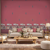 An architectural perspective of a high-ceilinged room featuring the Heritage Pichwai Wallpaper as a saturated feature wall. The mural’s bold magenta and jewel tones pair strikingly with traditional carved wooden furniture, neutral upholstery, and brass accents, creating a space that blends classical Indian heritage with a high-energy, modern aesthetic.