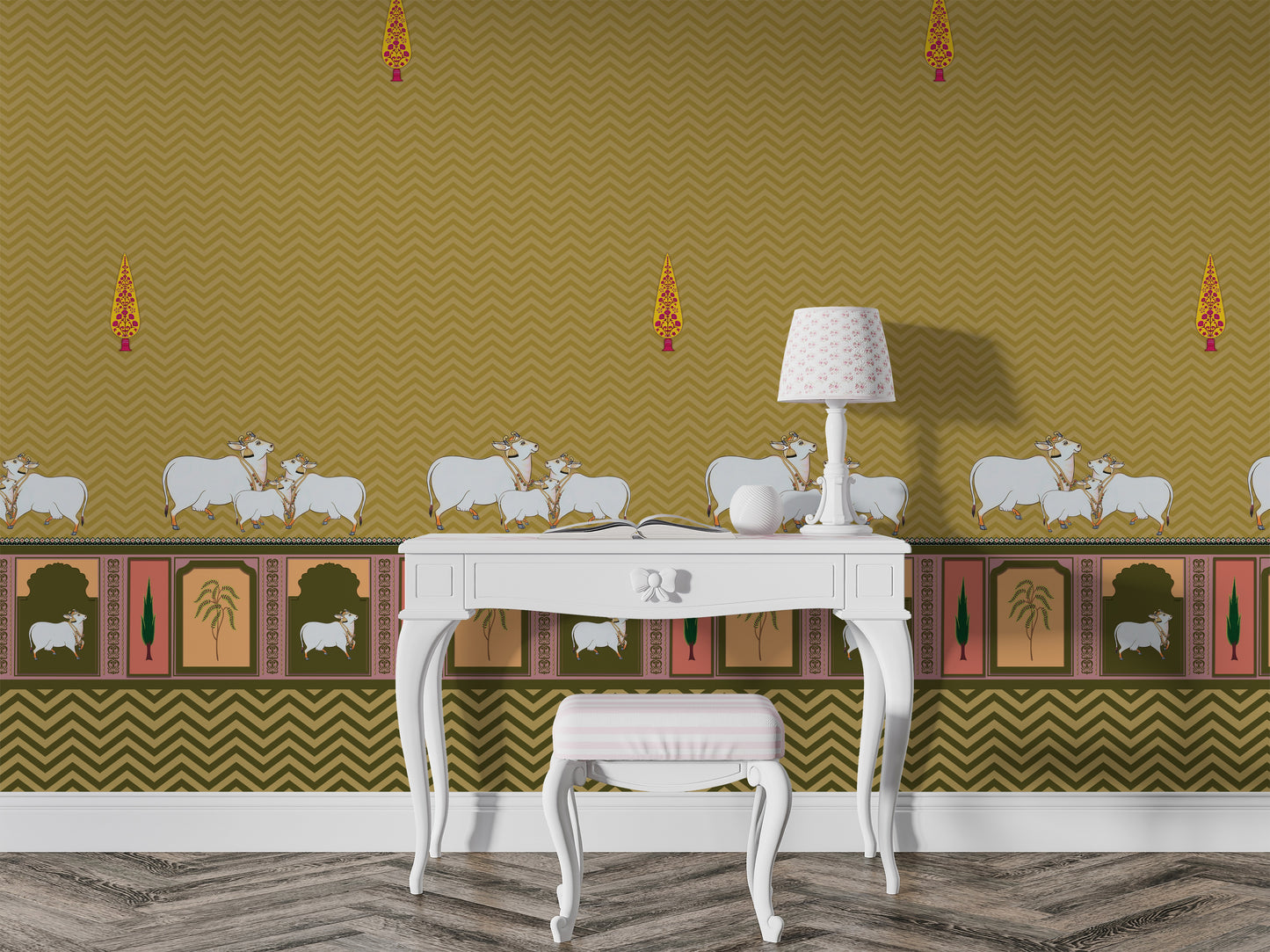 A high-resolution detail of the Heritage Pichwai Seamless Wallpaper, showcasing the intricate repeat pattern of stylized cypress trees and the ornate lower border. The design highlights traditional Pichwai motifs, including sacred cows and palms in decorative arches, rendered in vibrant mustard and ochre tones against a mustard ocher chevron-textured background.