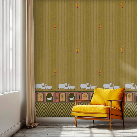 An architectural perspective of a high-ceilinged room featuring the Heritage Pichwai Wallpaper as a warm, inviting feature wall. The mural’s golden and earthy tones pair strikingly with traditional carved wooden furniture, neutral linen upholstery, and brass accents, creating a space that blends classical Indian heritage with a cozy, modern-rustic aesthetic.