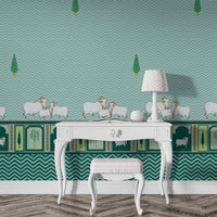 A high-resolution detail of the Heritage Pichwai Seamless Wallpaper, showcasing the intricate repeat pattern of stylized cypress trees and the ornate lower border. The design highlights traditional Pichwai motifs, including sacred cows and palms in decorative arches, rendered in rich teal and emerald tones against a deep teal chevron-textured background.
