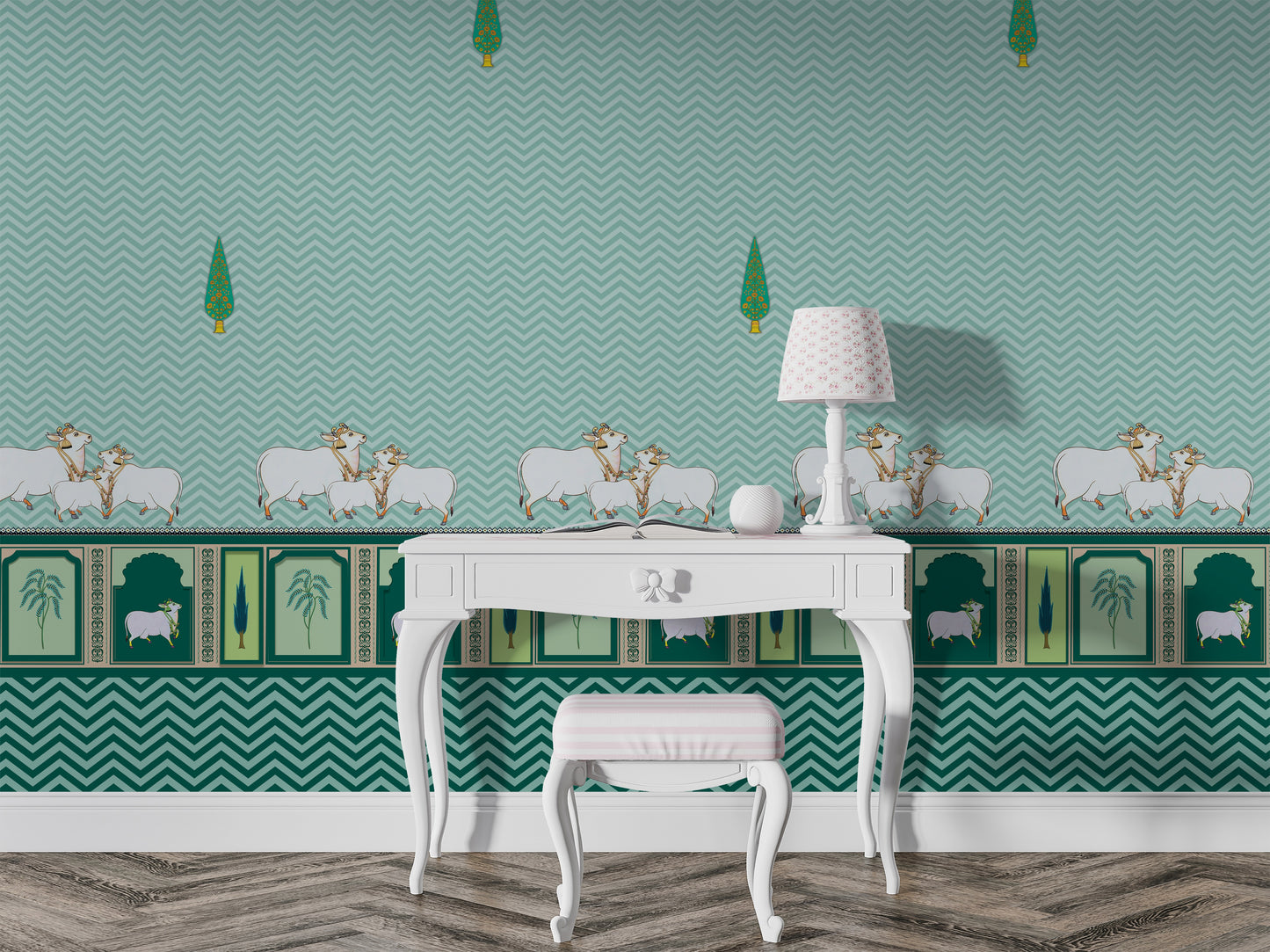 A high-resolution detail of the Heritage Pichwai Seamless Wallpaper, showcasing the intricate repeat pattern of stylized cypress trees and the ornate lower border. The design highlights traditional Pichwai motifs, including sacred cows and palms in decorative arches, rendered in rich teal and emerald tones against a deep teal chevron-textured background.