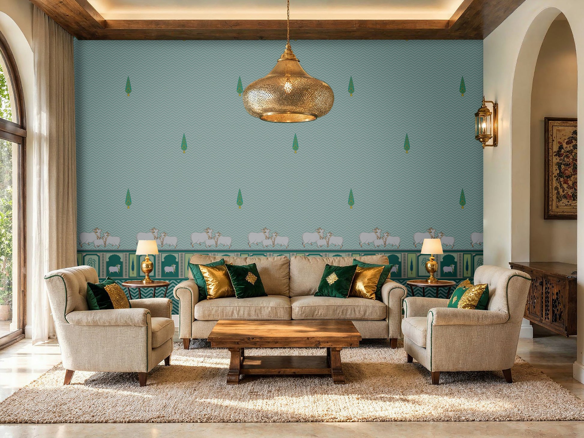 An architectural perspective of a high-ceilinged room featuring the Heritage Pichwai Wallpaper as a moody, sophisticated feature wall. The mural’s deep teal and jewel tones pair strikingly with traditional carved wooden furniture, velvet upholstery, and brass accents, creating a space that blends classical Indian heritage with a modern, luxe aesthetic.