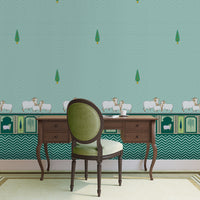 An architectural perspective of a high-ceilinged room featuring the Heritage Pichwai Wallpaper as a moody, sophisticated feature wall. The mural’s deep teal and jewel tones pair strikingly with traditional carved wooden furniture, velvet upholstery, and brass accents, creating a space that blends classical Indian heritage with a modern, luxe aesthetic.