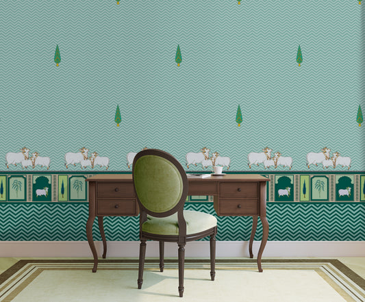 An architectural perspective of a high-ceilinged room featuring the Heritage Pichwai Wallpaper as a moody, sophisticated feature wall. The mural’s deep teal and jewel tones pair strikingly with traditional carved wooden furniture, velvet upholstery, and brass accents, creating a space that blends classical Indian heritage with a modern, luxe aesthetic.