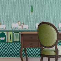 An architectural perspective of a high-ceilinged room featuring the Heritage Pichwai Wallpaper as a moody, sophisticated feature wall. The mural’s deep teal and jewel tones pair strikingly with traditional carved wooden furniture, velvet upholstery, and brass accents, creating a space that blends classical Indian heritage with a modern, luxe aesthetic.