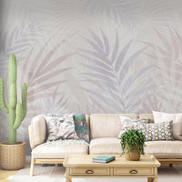 An architectural perspective of a contemporary sunlit lounge featuring the Hush Leaves Mural in Pale Lilac as a full-scale feature wall. The mural’s soft purple tones pair elegantly with beige velvet upholstery, light oak furniture, and natural woven accents, creating a serene and sophisticated interior sanctuary.