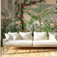 An architectural perspective of a contemporary sunroom or living area featuring the Jungle Abode Mural in Light Beige as a full-scale feature wall. The mural’s warm botanical style pairs elegantly with light oak flooring and cream-colored upholstery, creating a peaceful and cultured interior sanctuary.