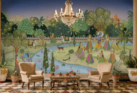 A high-resolution detail of the Krishna Pichwai Mural Wallpaper, showcasing the fine, traditional brushwork and ornamental detailing of the figures and flora. The image highlights the vibrant contrast between the saffron-clad Gopis and the rich, multi-tonal greenery of the Vrindavan landscape.