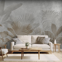 An architectural perspective of a contemporary living room featuring the Leafy Dreamscape Mural as a full-scale feature wall. The mural’s muted gray and tan tones pair elegantly with a cream-colored sofa, light wood furniture, and minimalist decor, creating a serene and sophisticated interior sanctuary.