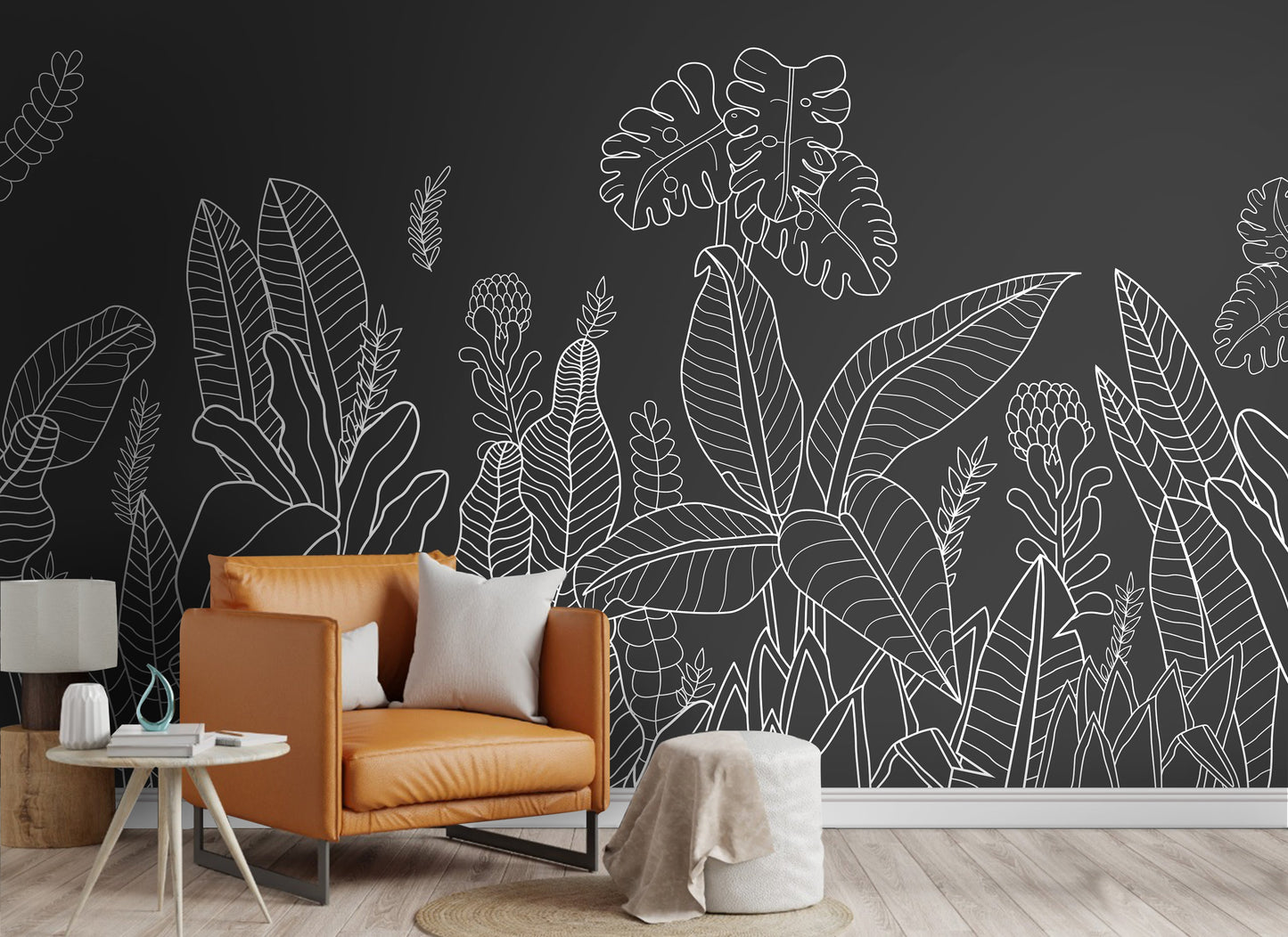 An architectural perspective of a modern living room featuring the Linear Tropical Forest Mural as a full-scale feature wall. The mural’s dark gray and white tones pair strikingly with a cognac leather armchair, light wood flooring, and minimalist furniture, creating a sophisticated and high-impact interior atmosphere.