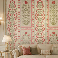 Luxury living room with blush pink and ivory floral wallpaper, cream sofas, gold accents, an ornate chandelier, and an elegant traditional interior.