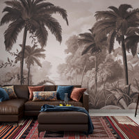 An architectural perspective of a contemporary lounge featuring the Luxe Tropical Greens Mural in Hazelnut Brown as a full-scale feature wall. The mural’s expansive jungle vista pairs elegantly with natural oak furniture and leather accents, creating a peaceful and cultured interior sanctuary.