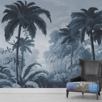 An architectural perspective of a contemporary lounge featuring the Luxe Tropical Greens Mural in Midnight Blue as a full-scale feature wall. The mural’s expansive jungle vista pairs elegantly with crisp white furniture and metallic accents, creating a peaceful and cultured interior sanctuary.
