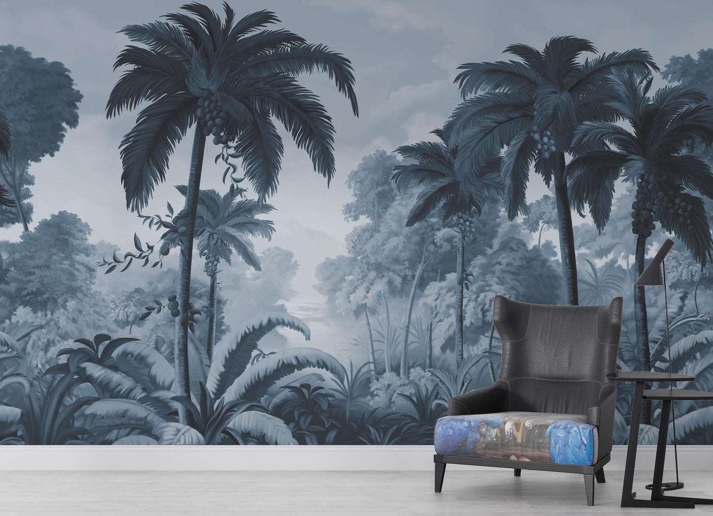 An architectural perspective of a contemporary lounge featuring the Luxe Tropical Greens Mural in Midnight Blue as a full-scale feature wall. The mural’s expansive jungle vista pairs elegantly with crisp white furniture and metallic accents, creating a peaceful and cultured interior sanctuary.