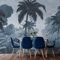 An architectural perspective of a contemporary lounge featuring the Luxe Tropical Greens Mural in Midnight Blue as a full-scale feature wall. The mural’s expansive jungle vista pairs elegantly with crisp white furniture and metallic accents, creating a peaceful and cultured interior sanctuary.